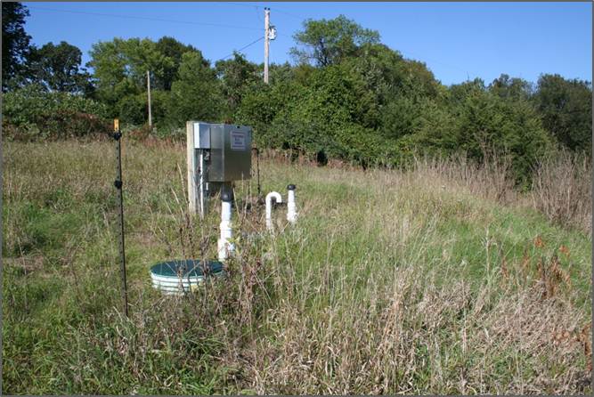 septic lift station in a field 